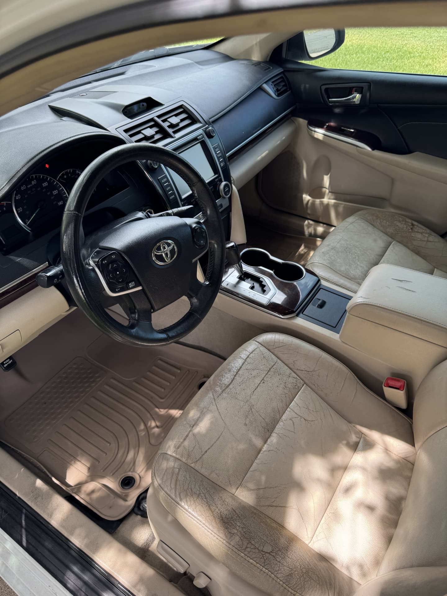 Toyota Camry cream leather seats after interior detailing