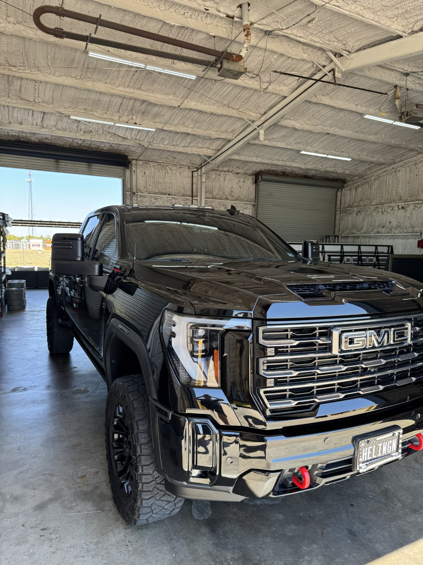 Black GMC Sierra truck fully detailed with a mirror shine
